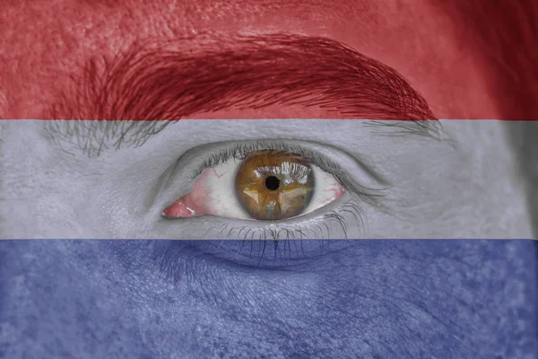 人脸和眼睛画着荷兰国旗 — 图库照片