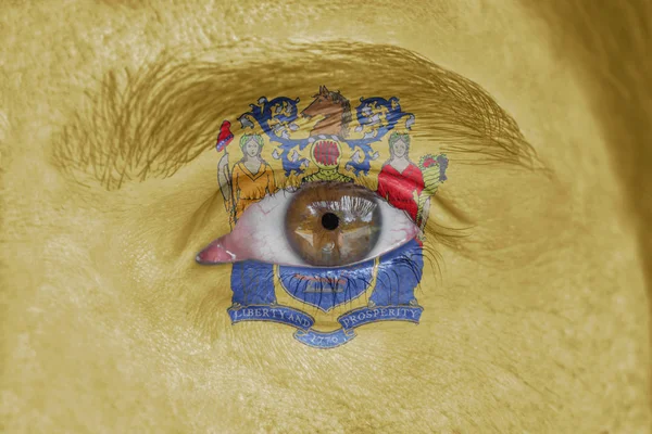 İnsan yüz ve göz bizimle New Jersey eyalet bayrağı boyalı