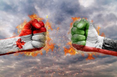 İki Kanada bayrağı ile yumruk ve Birleşik Arap Emirlikleri birbirlerine karşı karşıya mücadele için hazır