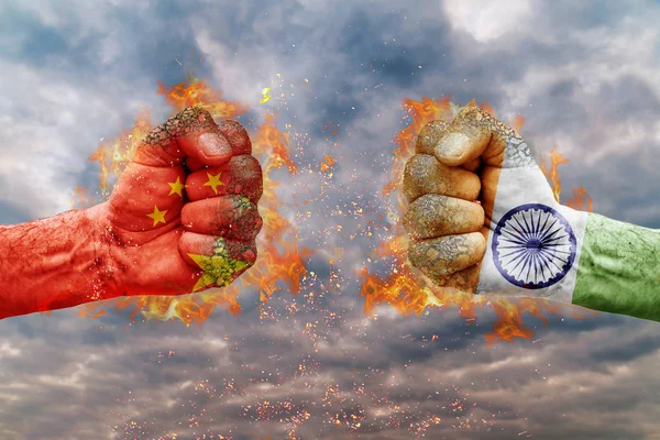 Two fist with the flag of China and India faced at each other ready for fight — Stock Photo, Image