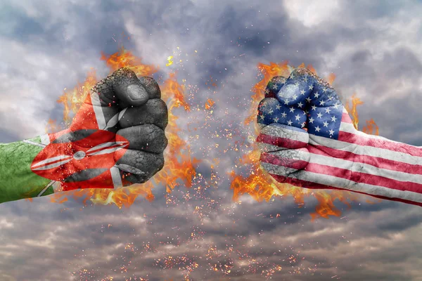 Two fist with the flag of Kenya and USA faced at each other ready for fight — Stock Photo, Image