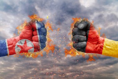Kuzey Kore bayrağı ile iki yumruk ve Almanya birbirlerine karşı karşıya mücadele için hazır