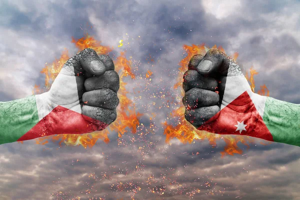 İki Filistin bayrağı ile yumruk ve Jordan birbirlerine karşı karşıya mücadele için hazır