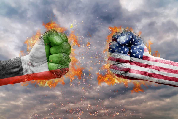 Two fist with the flag of United Arab Emirates and USA faced at each other ready for fight — Stock Photo, Image