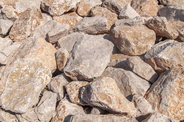 Big red and yellow sea stone on coast on island Rhodes — Stock Photo, Image