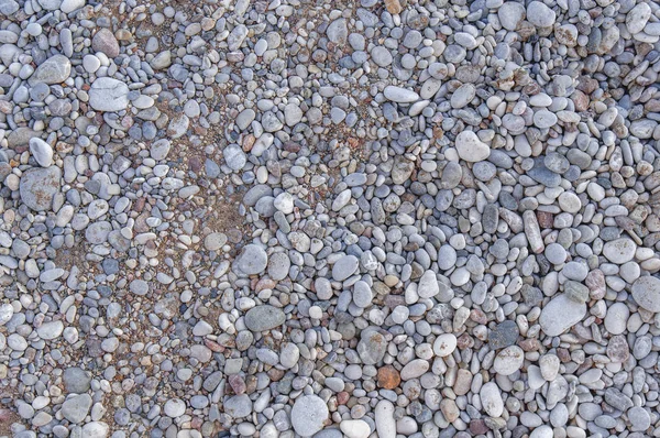 Detail of beach in greece made of small pebble stone texture — Stock Photo, Image