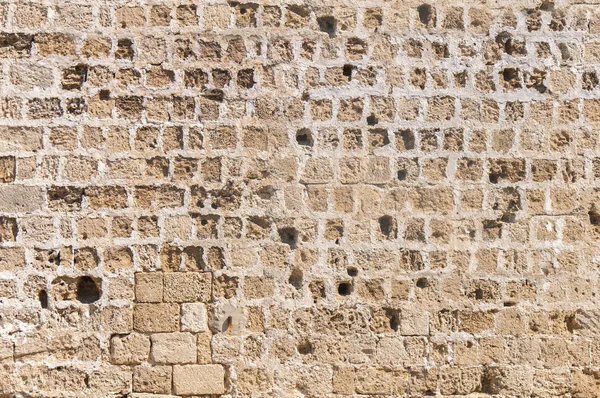 Візерунок цементного кам'яного блоку з замкової стіни з великою кількістю отвору — стокове фото