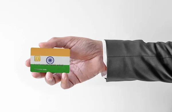 Bank credit plastic card with flag of India holding man in elegant suit — Stock Photo, Image