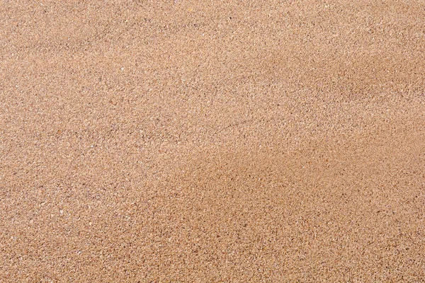 ビーチの小さな石の砂の背景として — ストック写真