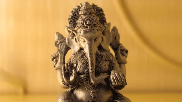 Lord Ganesha and Hinduism. Deity Ganesha with incense. Ganesha as a symbol of Hinduism, the God of wisdom and prosperity — Stock Photo, Image