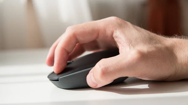 close-up of a computer mouse on a white background. Input device for computer. Shallow focus