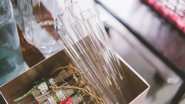 glass vials to decorate in boho style. Glass decoration at the event. Vintage glass flask. Shallow focus