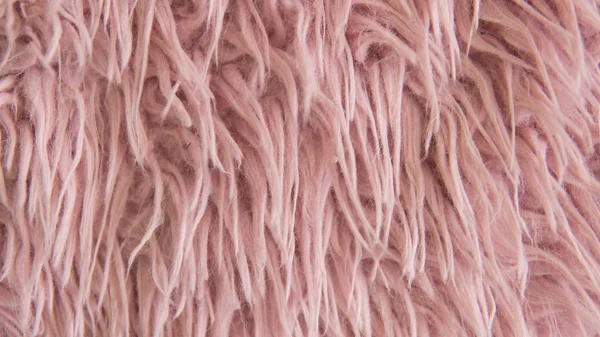 Artificial fur of pink color. Fashion goes to artificial fur