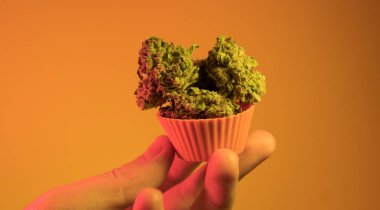  baking cupcakes and cookies from medical marijuana close-up clipart