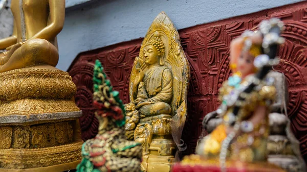 Buddhist and Hindu statues of deities in ritual rites and traditions today