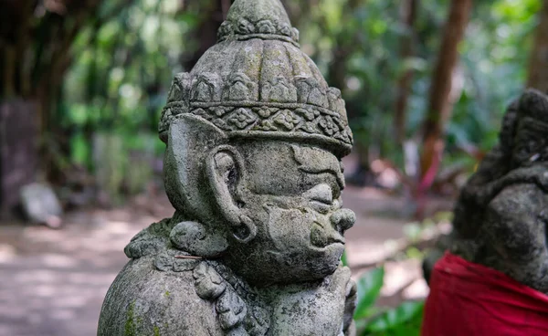 Buddhist and Hindu statues of deities in ritual rites and traditions today