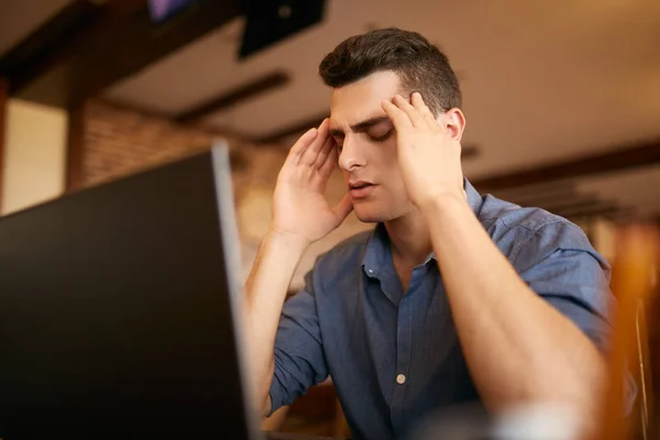 Serious frustrated businessman with closed eyes suffering from headache migraine at workplace, massaging temples. Feeling tired exhausted. Chronic work stress. Tries to remember important information — Stock Photo, Image