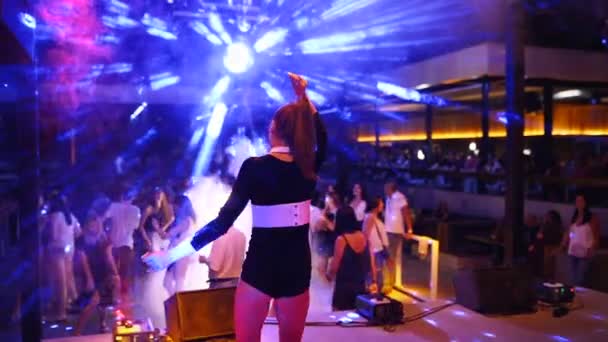 Mariupol, Ukraine - 15 June 2019. PJ or go-go dancer woman performs on stage at Barbaris night club on weekend party. Attractive girl dance at disco. — Stock Video