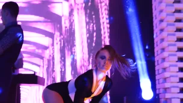 Mariupol, Ukraine - 15 June 2019. PJ or go-go dancer woman performs on stage at Barbaris night club on weekend party. Attractive girl dance at disco. — ストック動画