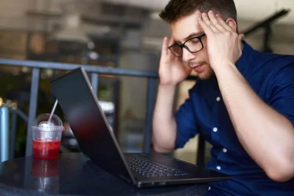 Serious frustrated businessman with closed eyes suffering from headache migraine at workplace, massaging temples. Feeling tired exhausted. Chronic work stress. Tries to remember important information — Stock Photo, Image