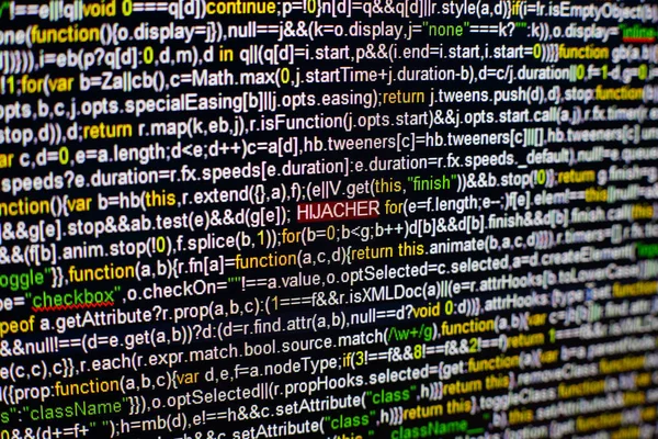 Macro foto de la pantalla del ordenador con el código fuente del programa y resaltó la inscripción HIJACKER en el medio. Guión en la pantalla con virus en ella. Concepto de seguridad cibernética. Contexto tecnológico . — Foto de Stock
