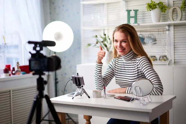 Caucasian female beauty blogger showing thumbs up with positive emotions, happiness. Satisfaction with quality and recommendation of cosmetics products. Makup artist asks to like, follow her channel — Stock Photo, Image