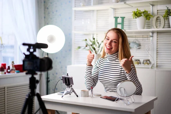 Caucasian female beauty blogger showing thumbs up with positive emotions, happiness. Satisfaction with quality and recommendation of cosmetics products. Makup artist asks to like, follow her channel — Stock Photo, Image