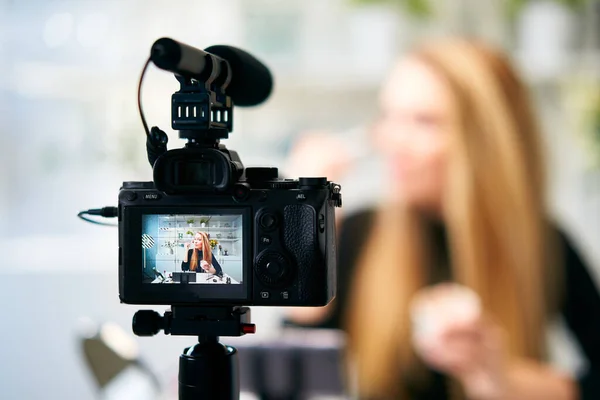 Display of camera recording video blog for blonde beauty blogger woman with make-up at home studio. Influencer vlogger girl live streaming cosmetics masterclass. Online learning and marketing concept. — Stock Photo, Image