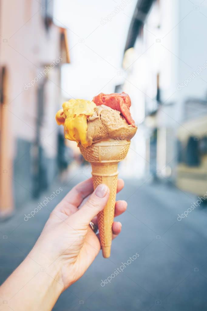 Females hand holding Gelato.