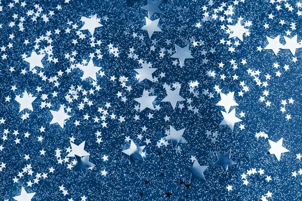 Klassisches Star-Konfetti auf blauem Hintergrund. — Stockfoto