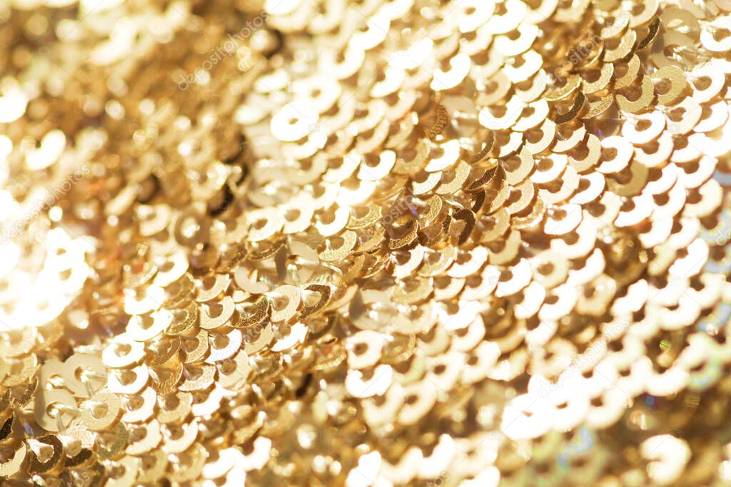 Sparkling golden sequined fabric.