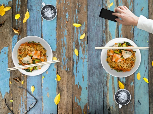 Bad manner of using smartphone while eating.