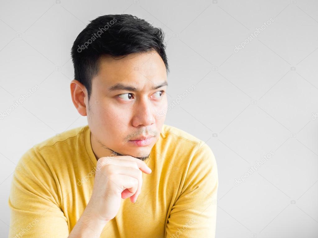Asian man is thinking.