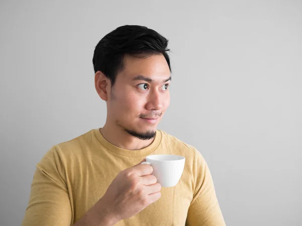 Asian man drinks coffee. — Stock Photo, Image