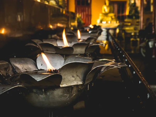 Oil lamp fire in temple.
