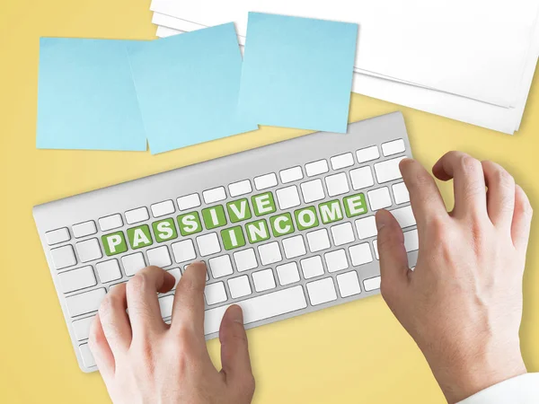 Passive Income concept on green keyboard button.