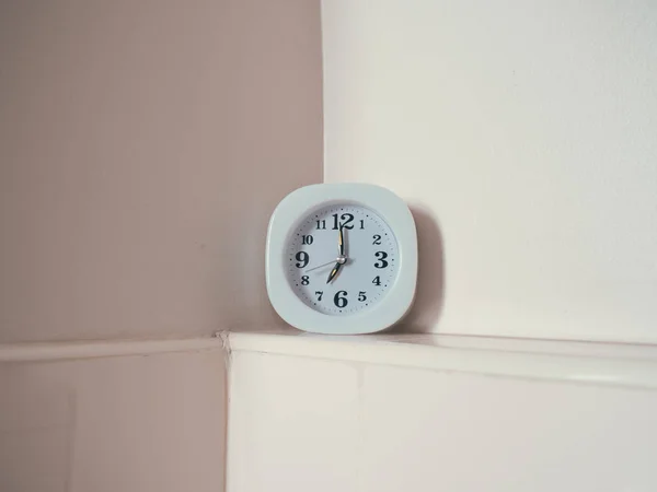 Concept of life routine with clock in the bathroom.