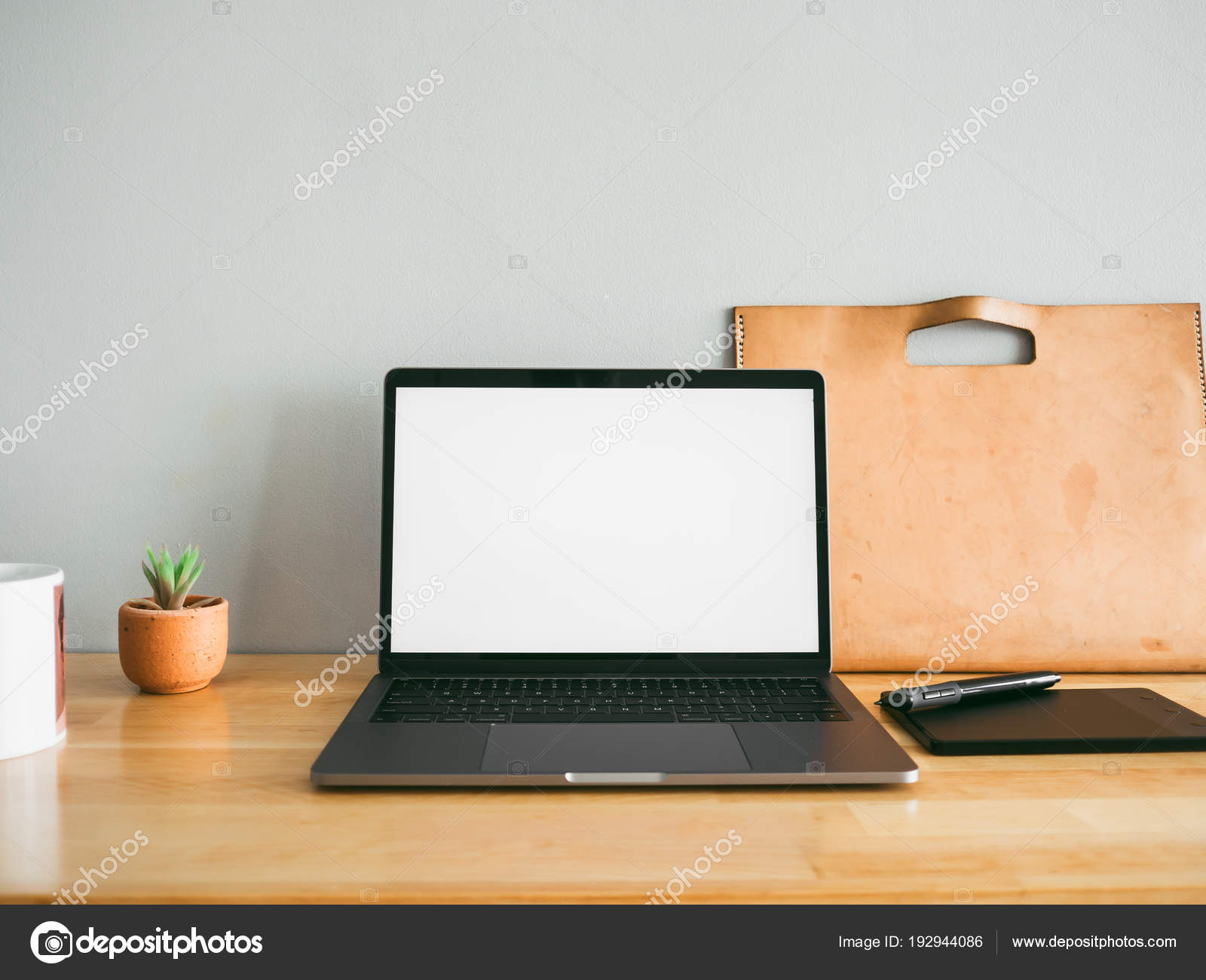 Laptop Some Stationary Items Wooden Work Desk Empty Gray Wall