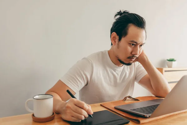 Man is working in his apartment in concept of Work From Home. — Stock Photo, Image