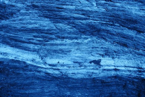 Draufsicht auf dunklen Steinhintergrund in blauer Farbe. — Stockfoto