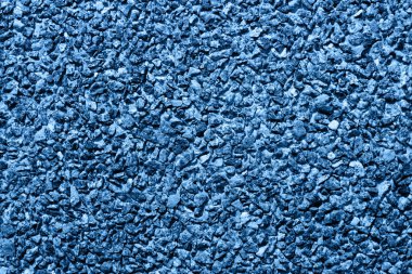 El yapımı çakıl taşları. Arka plan mavi renkli..