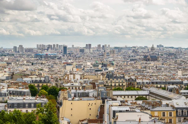 Paris roofs with a cloudy sky