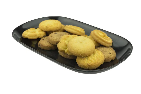 Biscotti su un piatto su uno sfondo bianco. Percorso di ritaglio. Pieno de — Foto Stock