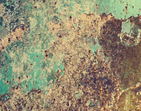 Іржавий кольоровий метал з потрісканою фарбою, гранжевим фоном — стокове фото