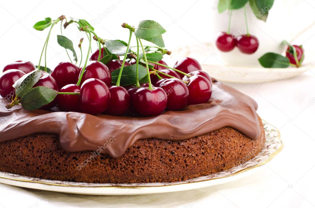 Chocolate cake with cherries and ganache cream.