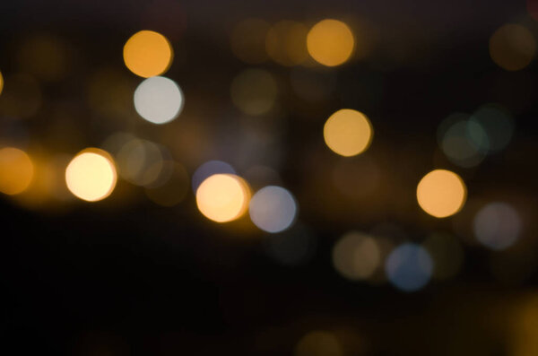 Christmas background. Festive abstract holidaysbackground with bokeh defocused lights and stars