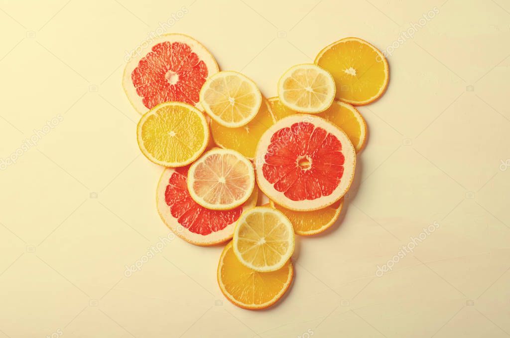 Citrus fruit Heart from slices of lemon, orange, grapefruit on white