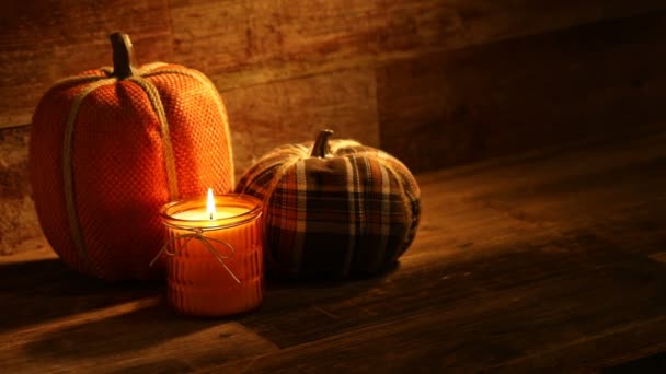 Autumn harvest candles and Pumpkins on retro wood background video — Stock Video