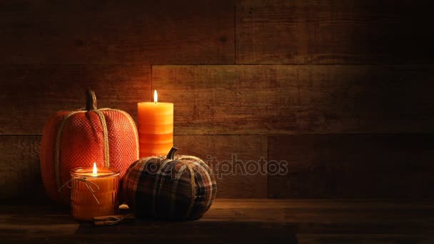 Autumn harvest candles and Pumpkins on retro wood background video — Stock Video