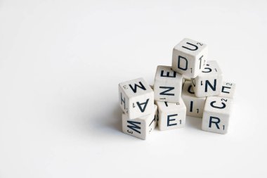 pile of cubes with letters and numbers on white  clipart